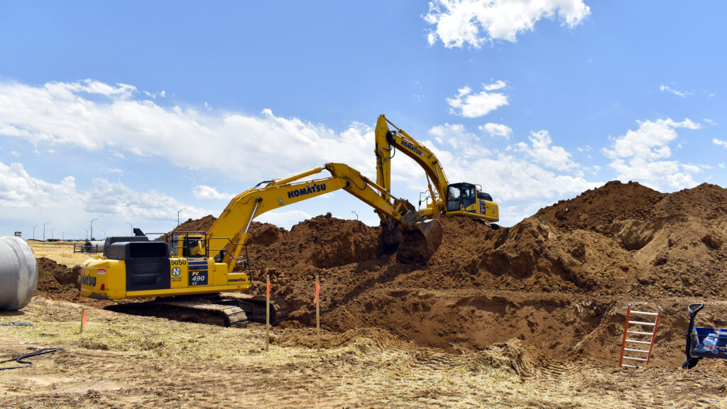 Excavators digging on job site