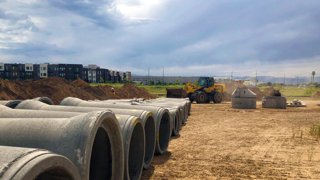 Cement pipes lined up on job site